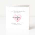 Valentine's Day card with pink heart and text on a white background