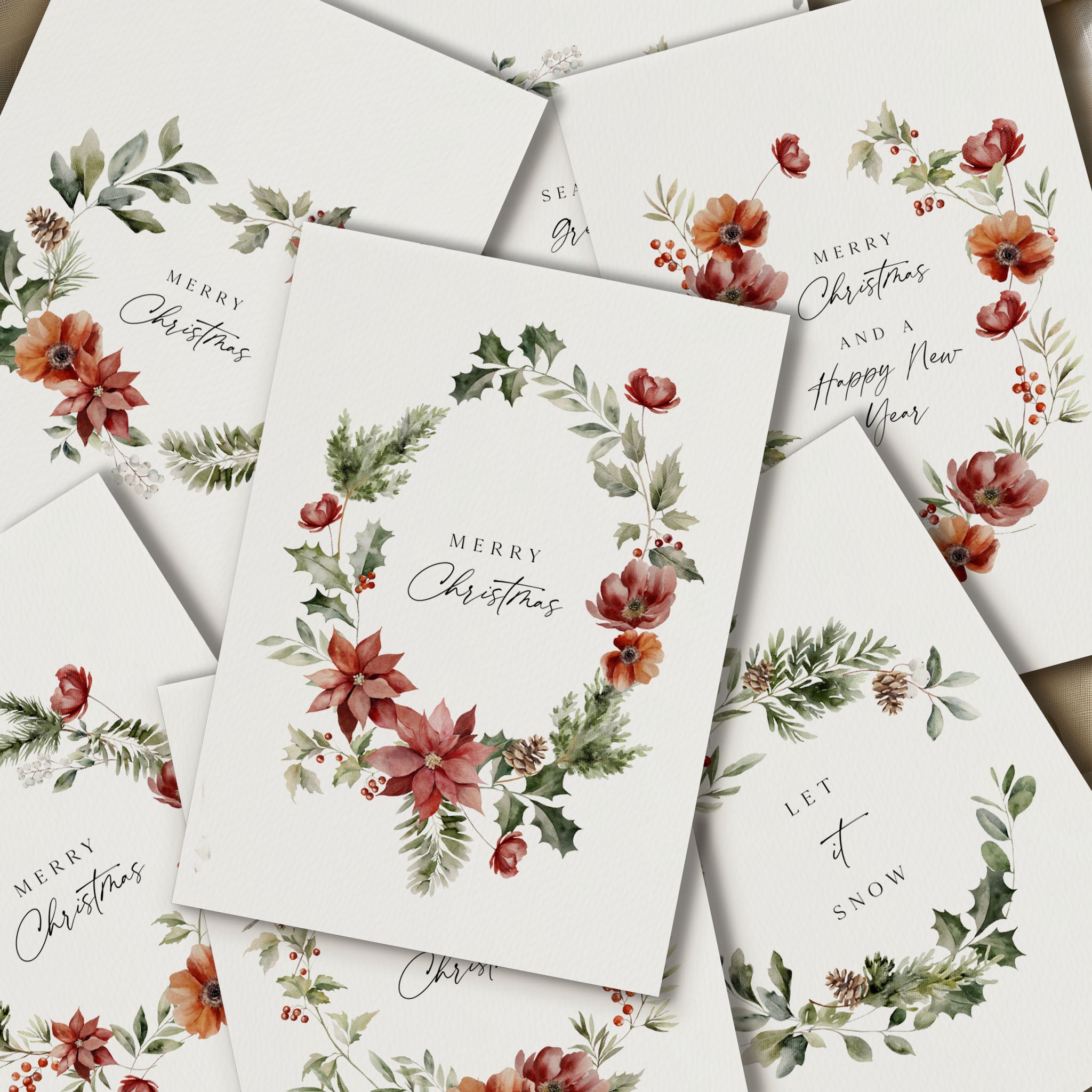 Stack of Christmas cards with floral designs and text.