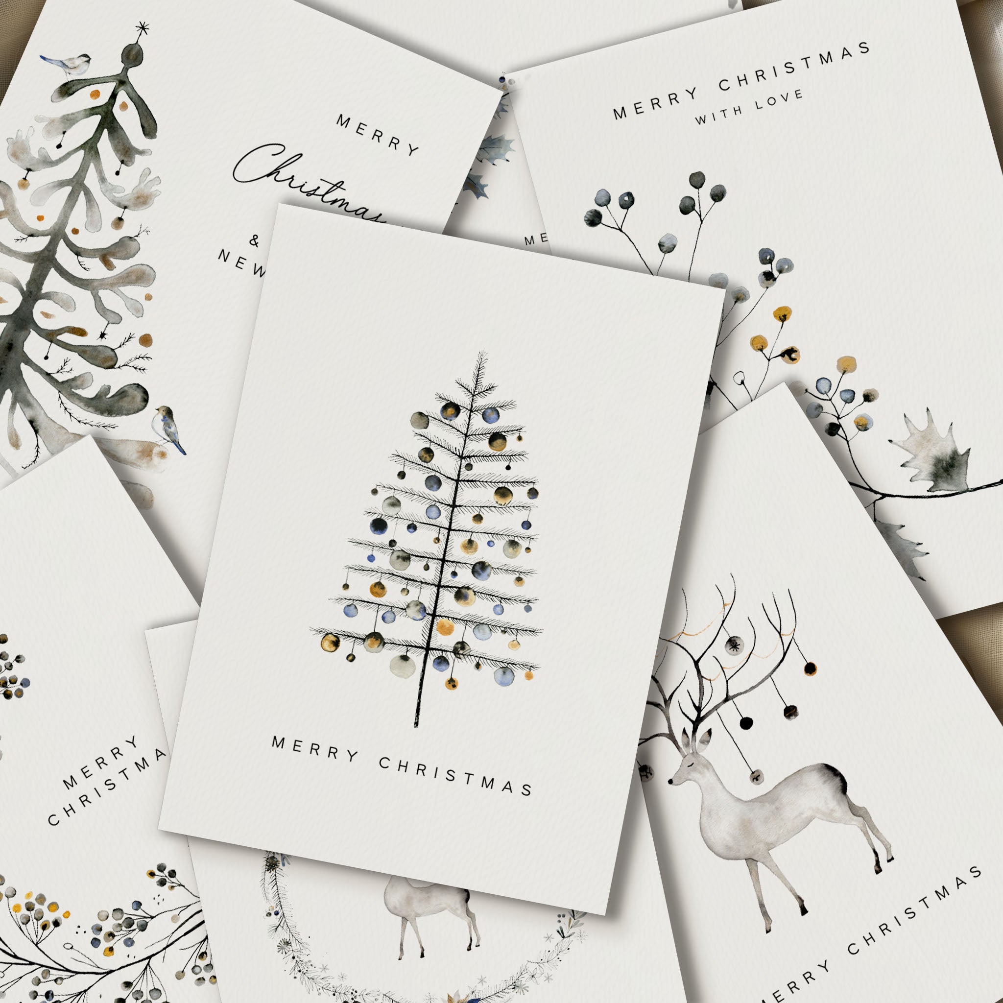 Collection of Christmas cards with tree, deer, and floral designs on a white background.