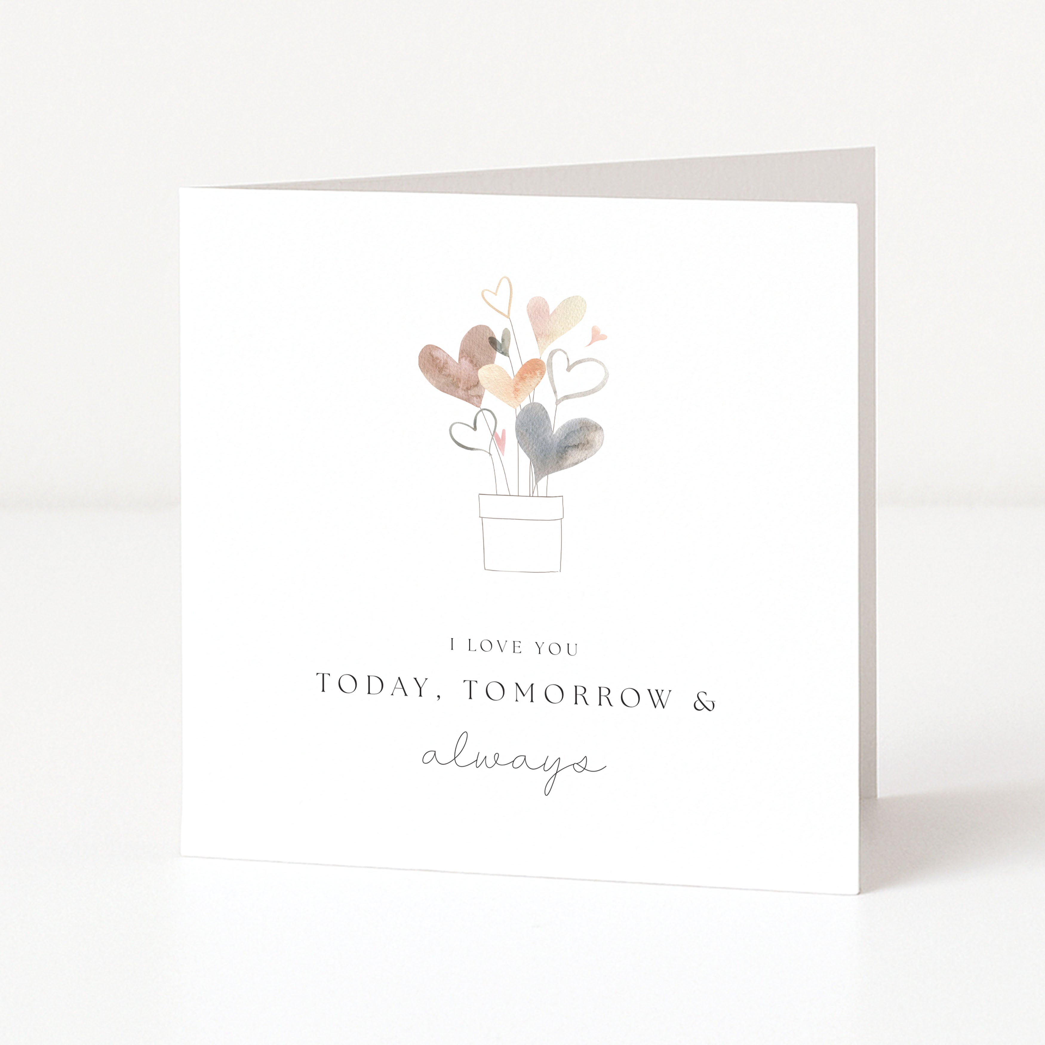 Greeting card with heart-shaped flowers and text 'I love you today, tomorrow & always' on a white background