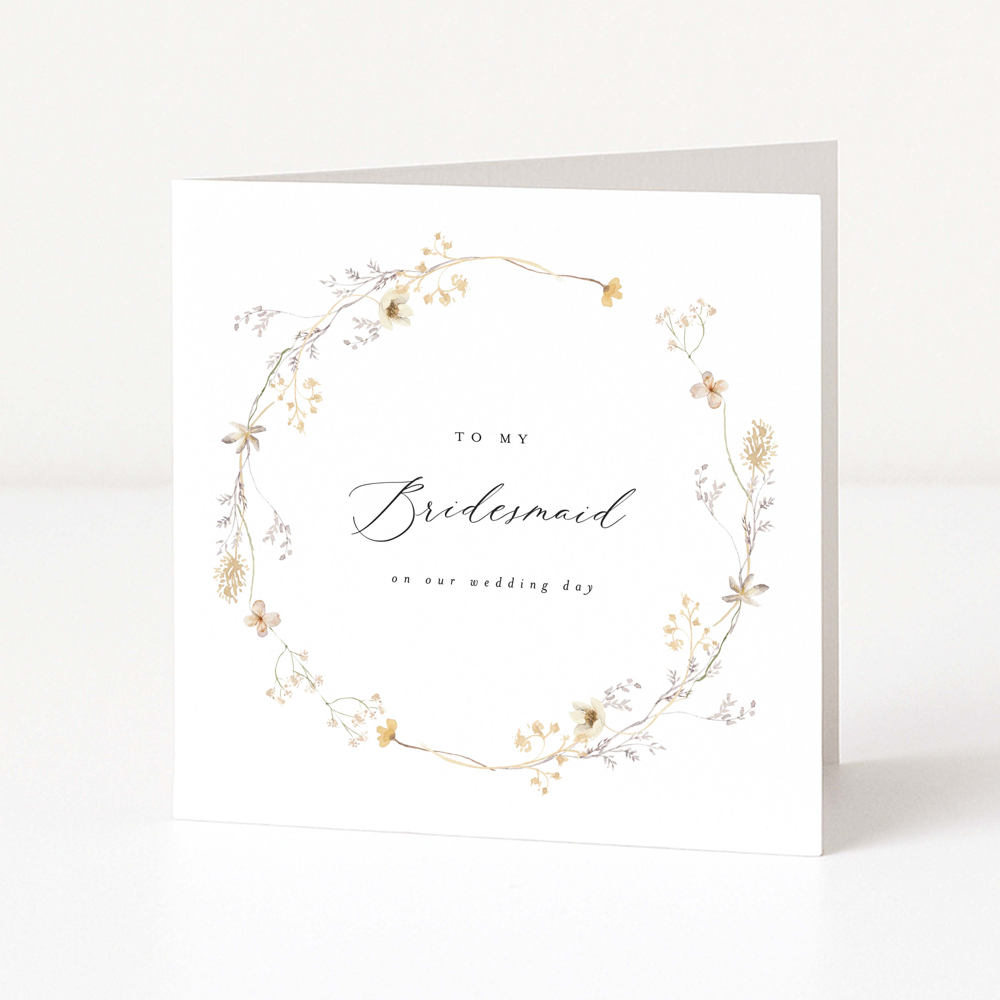 Greeting card with floral design and text 'To my Bridesmaid on our wedding day' on a white background