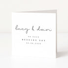 Greeting card with 'Lucy & Dan' and wedding date on a white background