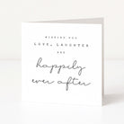 Greeting card with text 'Wishing you love, laughter and happily ever after' on a white background
