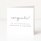 White card with black text 'congrats! ON YOUR WEDDING DAY HARRIET & GEORGE' on a white background