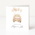 Greeting card with a vintage car and balloons, featuring 'Just married' text on a white background.