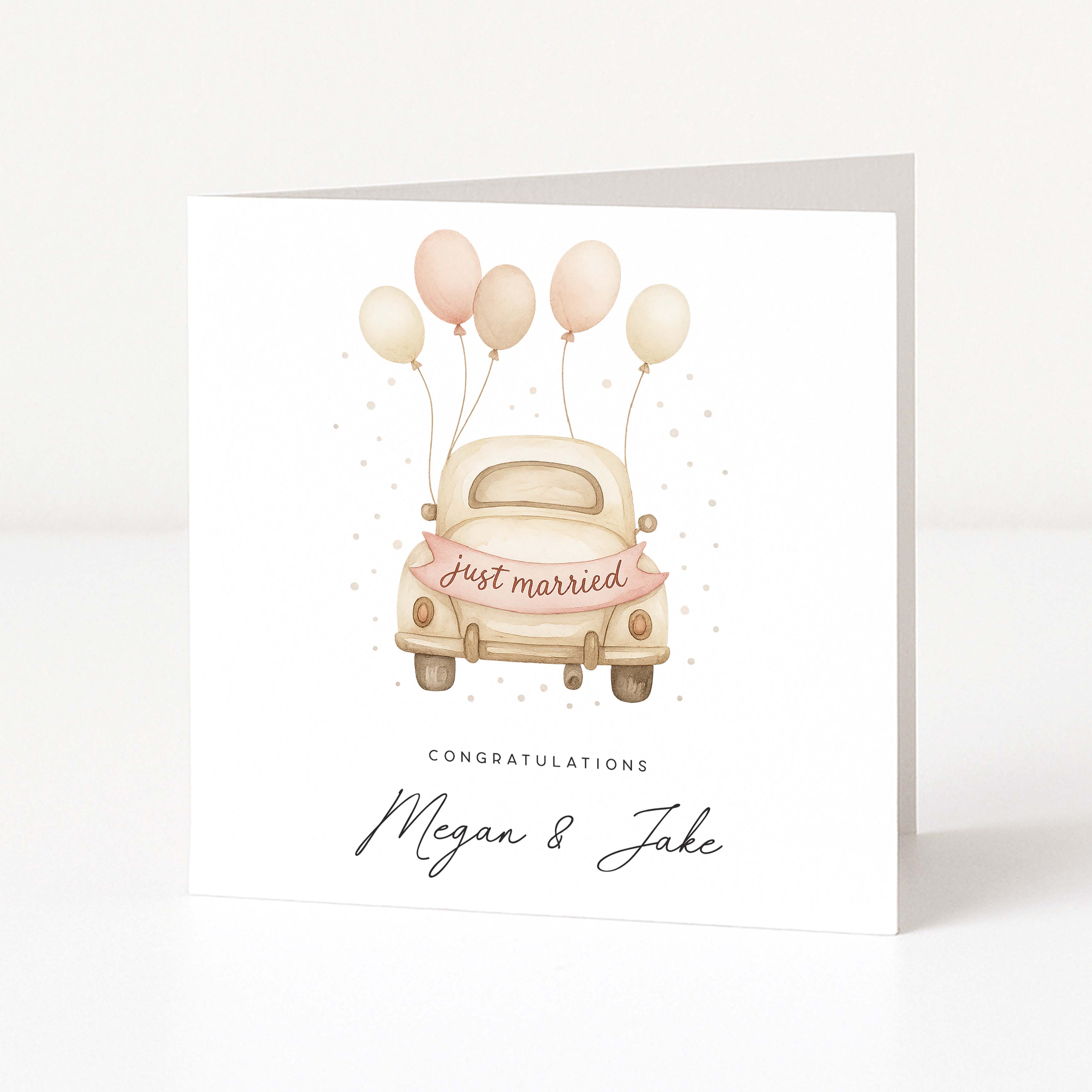 Greeting card with a vintage car and balloons, featuring 'Just married' text on a white background.