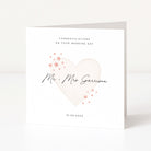 Wedding card with a heart design and personalized text on a white background