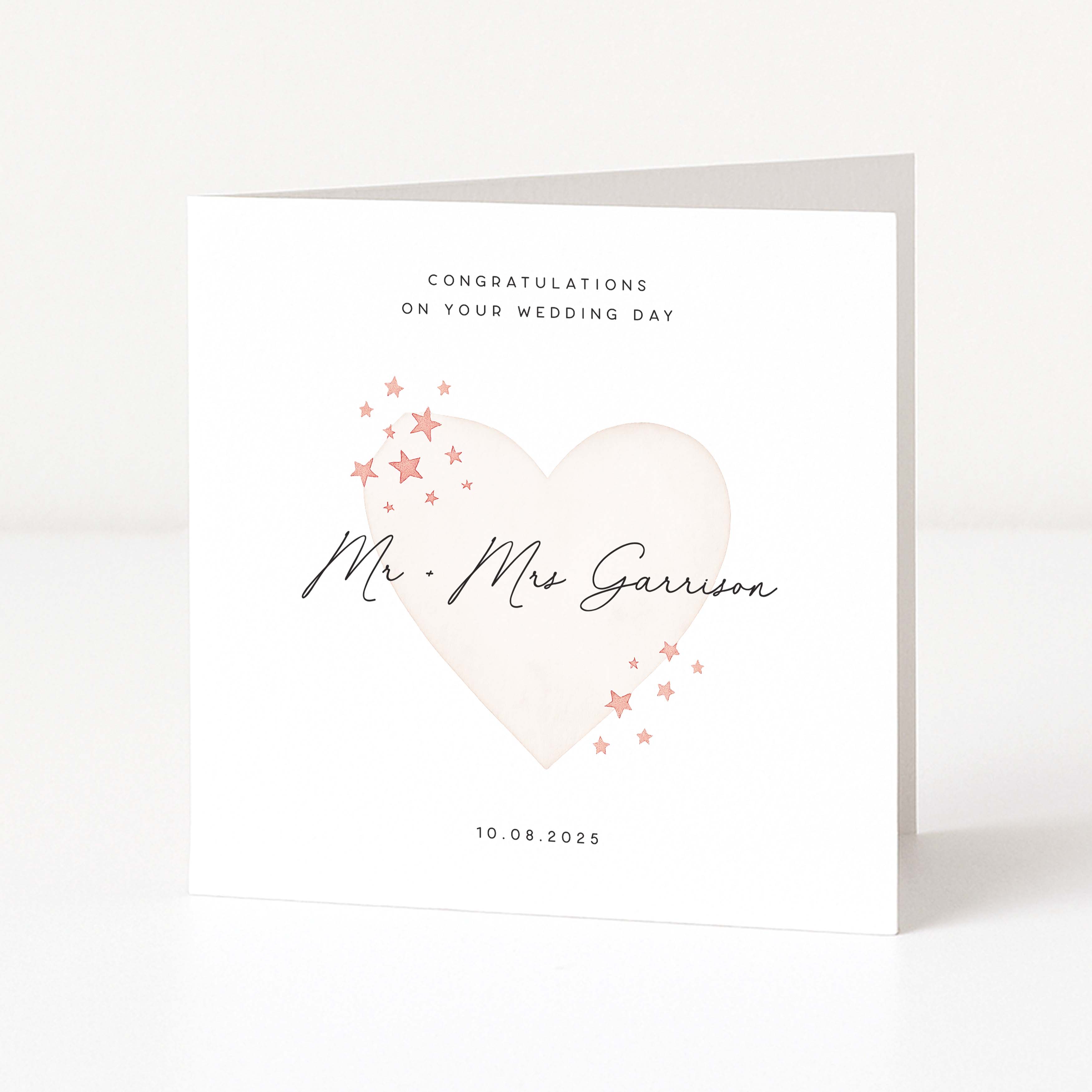 Wedding card with a heart design and personalized text on a white background