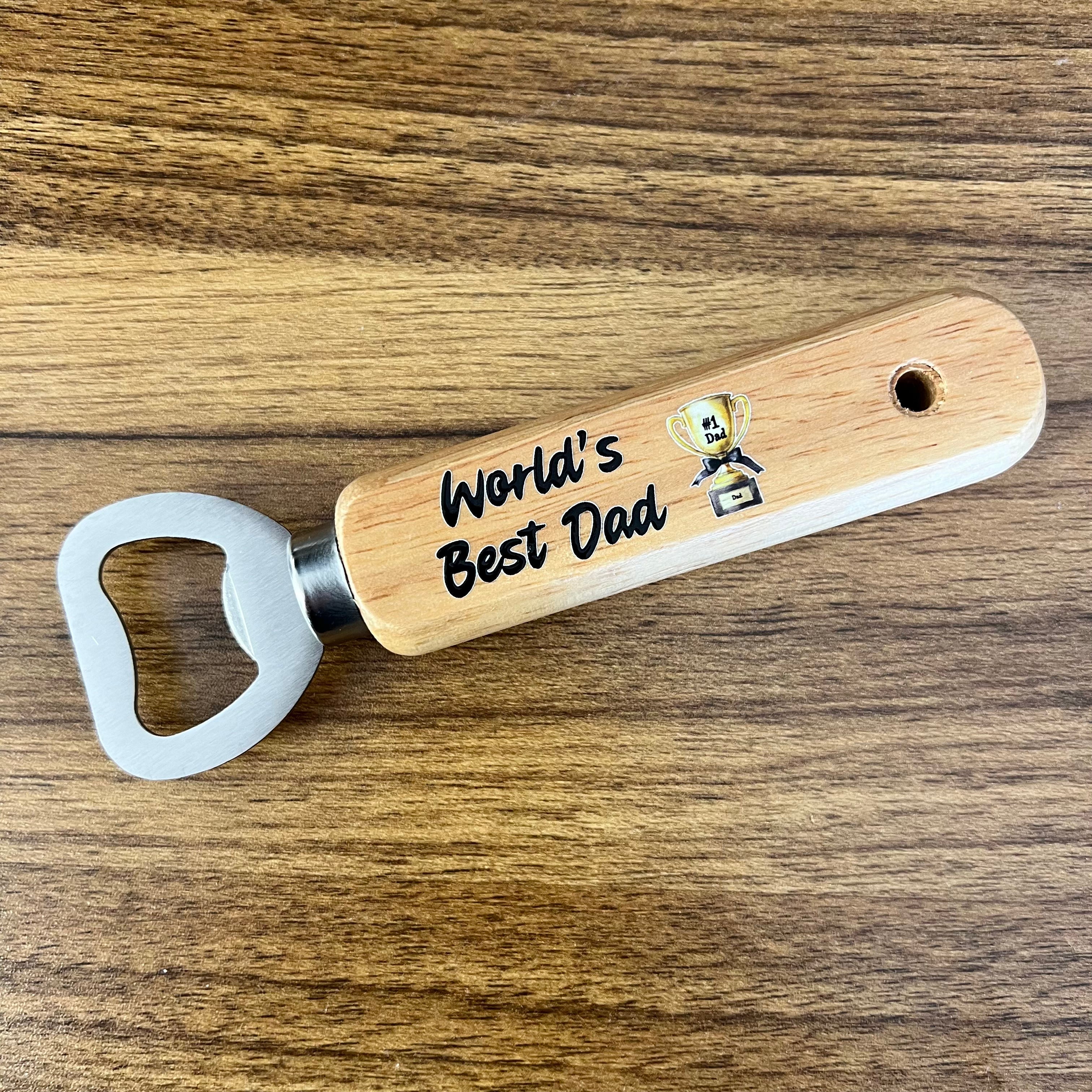 Wooden bottle opener with 'World's Best Dad' text on a wooden surface