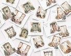 A collage of vintage-style illustrated postcards or art prints scattered on a white background, featuring watercolor winter scenes with doors, windows, plants, and cozy interior details.