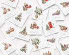 A scattered arrangement of square Christmas greeting cards on a light background. Each card features a delicate watercolor-style illustration, including a fireplace with a red sleigh, decorated trees, vintage trucks, and holiday motifs, with the text 'MERRY CHRISTMAS and a happy winter' in cursive script.