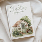 illiustrated a5 notebook with a hardcover that is personalised with charlotte garden notes" in green text. 