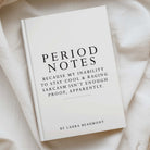 A hardcover book titled 'Period Notes' by Laura Beaumont, lying on draped cream fabric. The cover is white with black serif text and a thin horizontal line near the bottom.