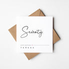 modern 70th birthday card with kraft envelope and white background