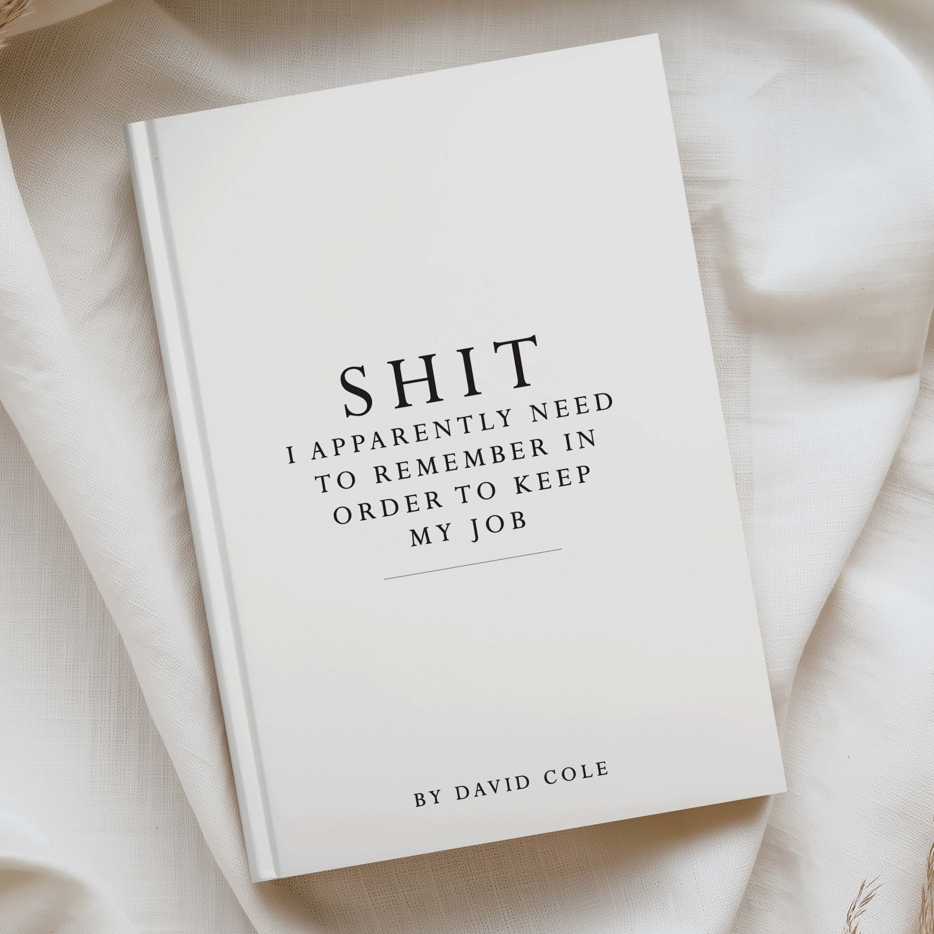 white a5 notebooks with "shit i need to remember in order to keep my job" printed on the front.